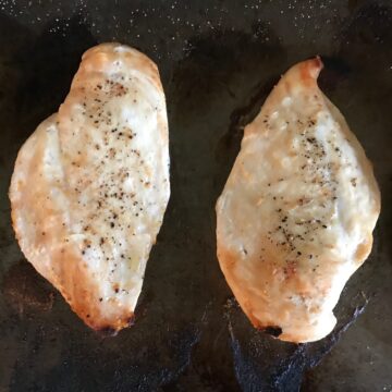 Cooked seasoned chicken breasts on a sheet pan to show options for storing chicken.