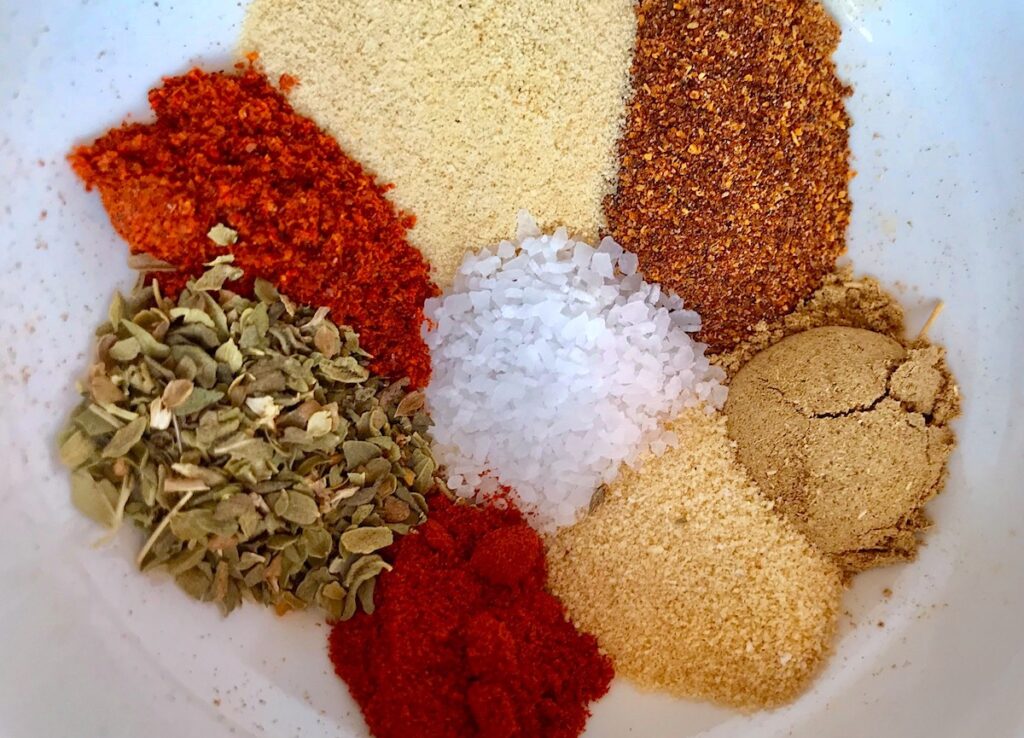 Cajun spices in a bowl before mixing them. One way to use your freezer for meal prep.