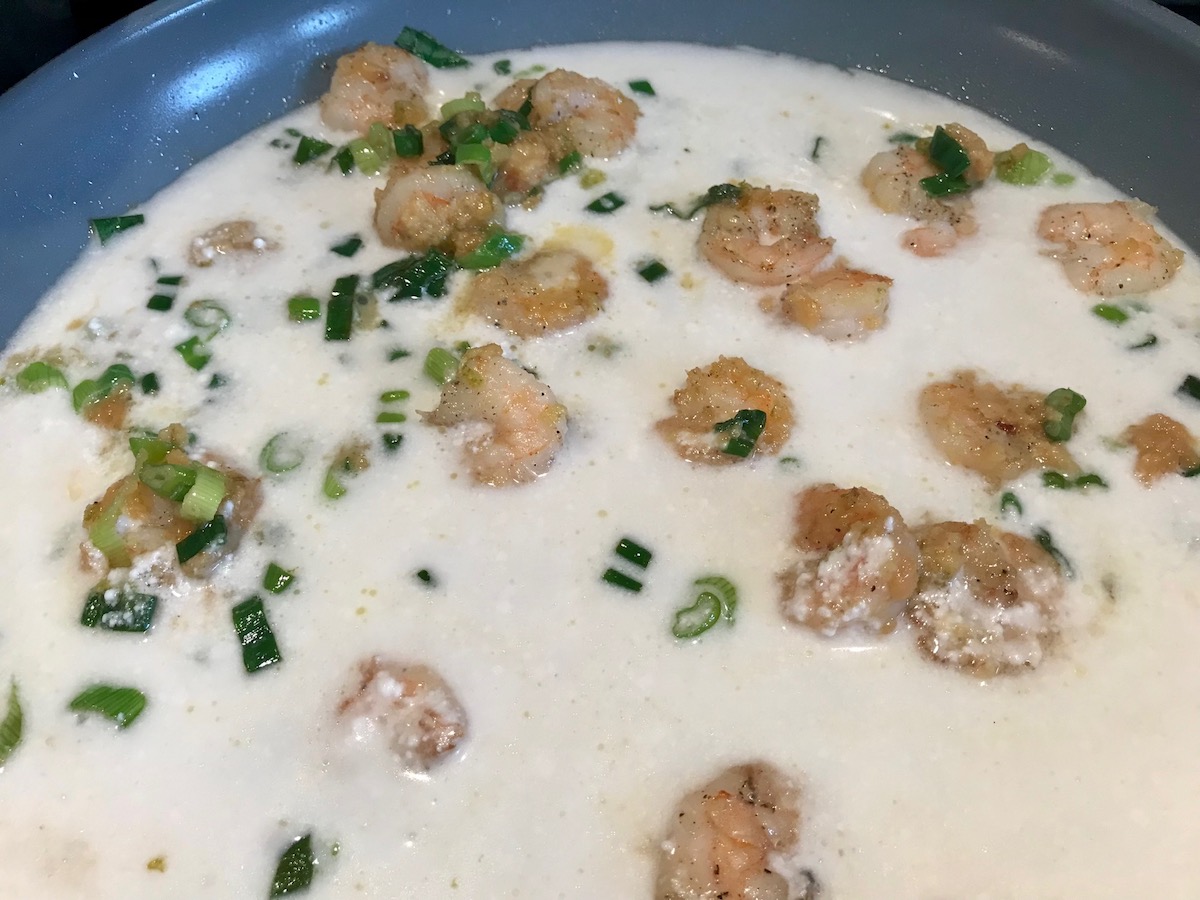 Coconut milk and shrimp mixture for Creamy Chinese Coconut Shrimp Recipe. It's filled with flavor from garlic, ginger, coconut, and more. Done in under 30 minutes, it's perfect for busy nights!