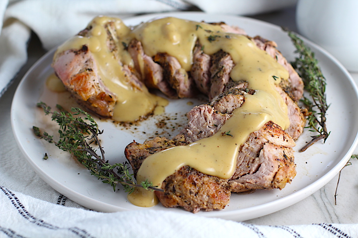 Thick gravy over sliced roast pork tenderloin. This Roast Pork Gravy Recipe is thick, creamy, and full of flavor.
