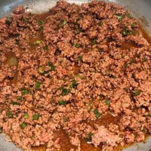 Cooked ground beef and taco seasoning for Taco Meat recipe.
