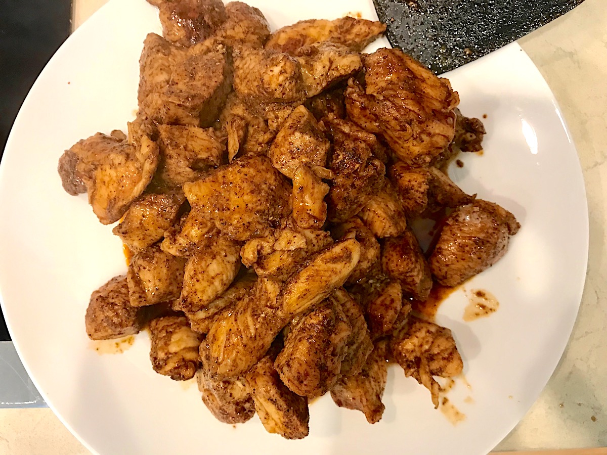 Cooked chicken transferred to a plate for Chipotle Chicken Pasta Recipe.