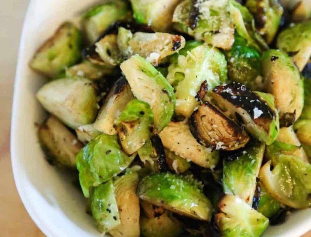 What to serve with pasta bake? This Butter and Garlic Roasted Brussles Sprouts from Eating Works.