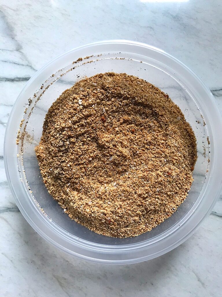 Beef seasoning recipe mixed in a clear bowl on a counter..