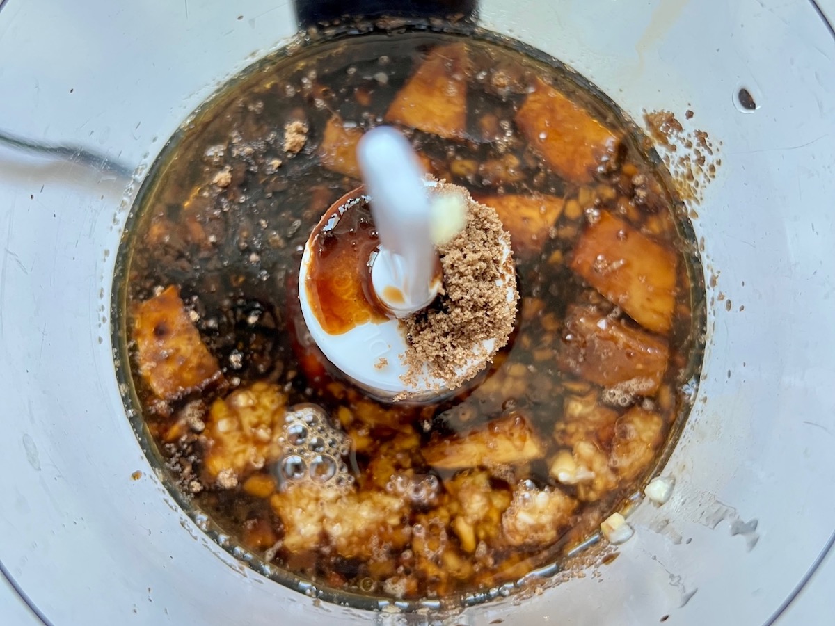 Garlic, ginger, soy sauce, sesame oil in food processor before blending for Korean Beef Stew.