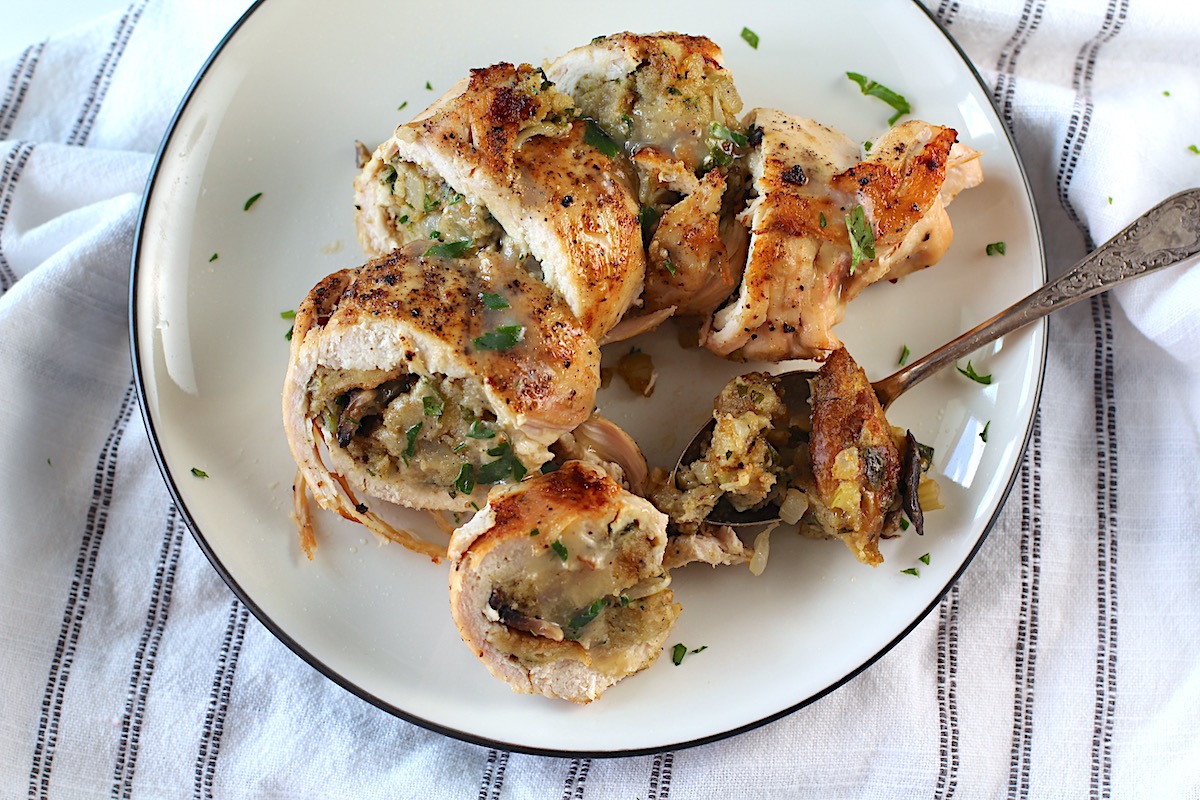 Stuffed chicken sliced on a plate. Stuffing stuffed chicken breast recipes are easy and delicious!