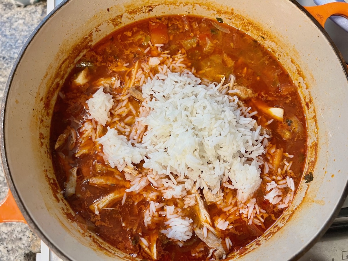 Rice and shredded chicken added to Spanish chicken soup recipe.