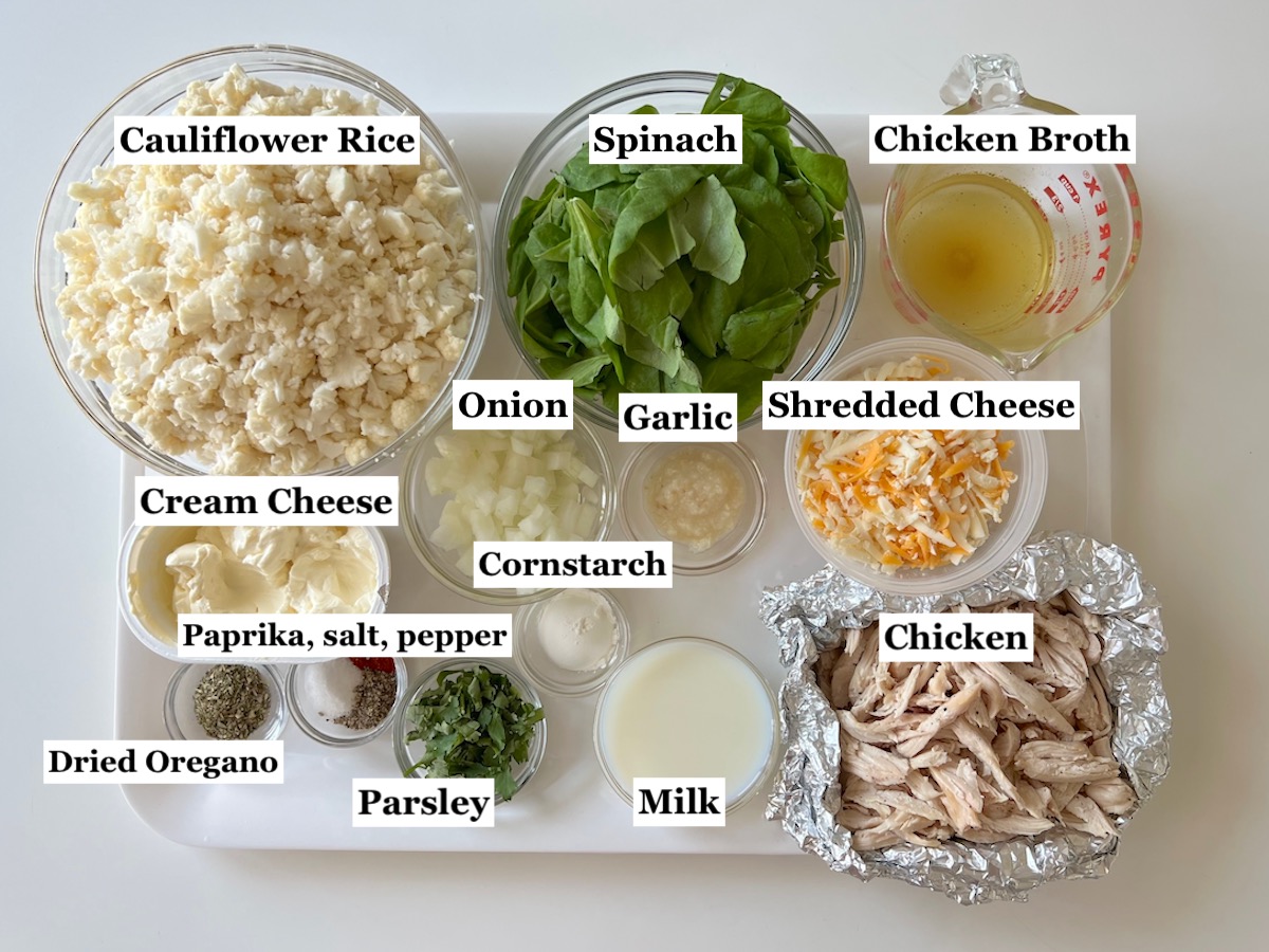 Picture with labels of ingredients prepped and measured out in bowls for the Chicken Cauliflower Bake.