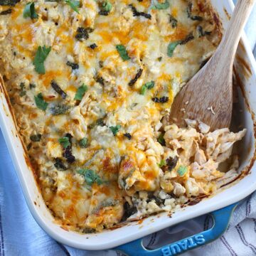 Chicken Cauliflower Bake in a casserole dish with a spatula scooping it in the corner.