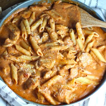 Chicken and penne pasta mixed into the tomato vodka sauce for Creamy Chicken and Vodka Pasta recipe.