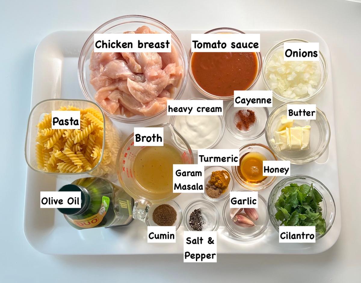 Ingredients shown are used to prepare 30 minute butter chicken pasta.