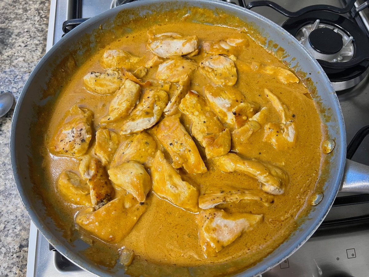 Cooked chicken breast pieces placed into the tomato mixture to serve.