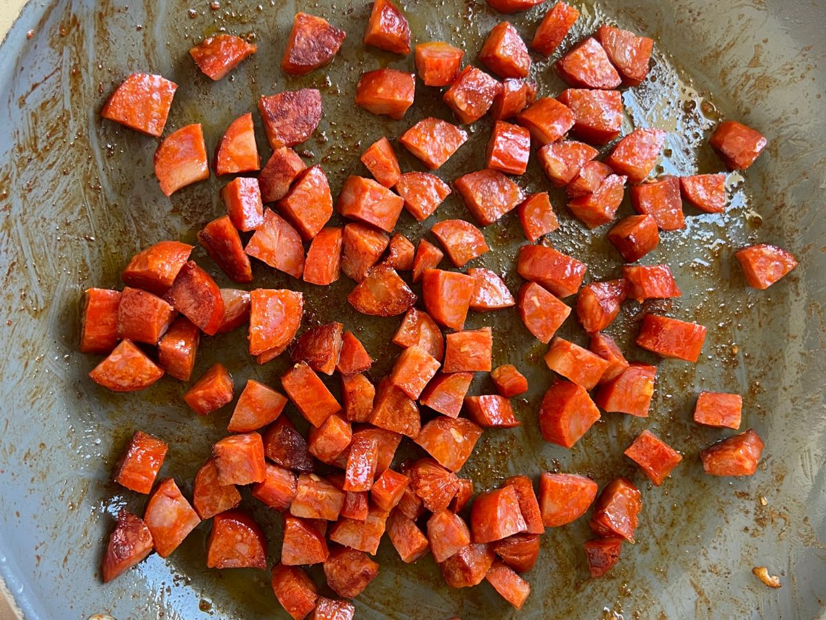 Using the same skillet as the chicken was sauteed, cook the diced chorizo pieces for pasta with chorizo and chicken.