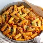 Creamy pasta with chorizo and chicken chunks combined in a creamy tomato sauce and garnished with parmesan cheese and parsley.