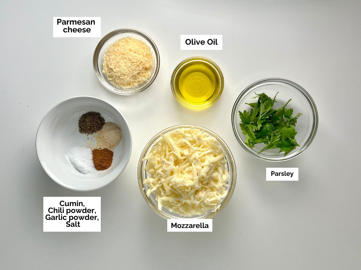 Ingredients shown are used to prepare cheesy cauliflower steaks.