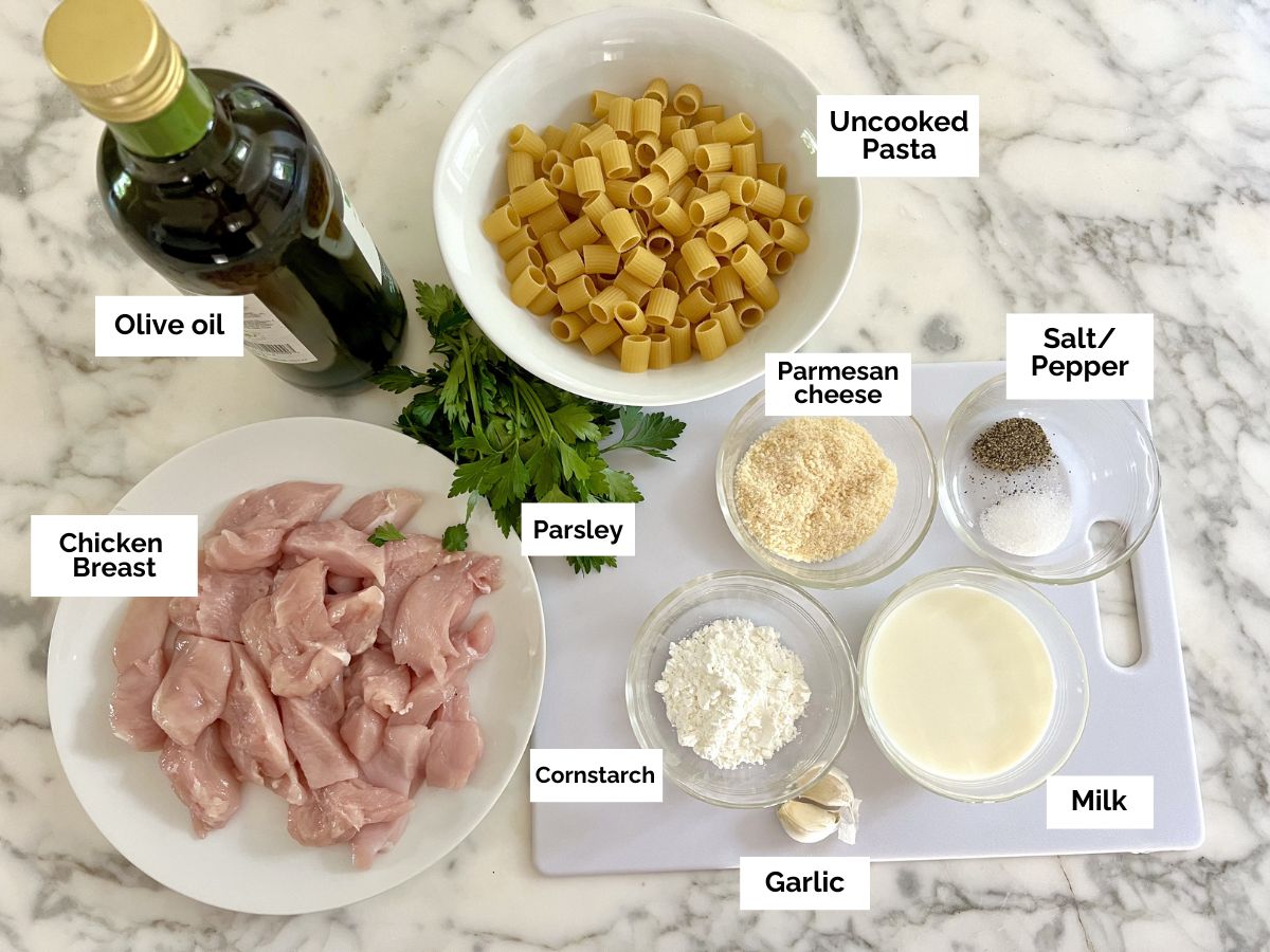Ingredients shown are used to prepare garlic chicken parmesan pasta.