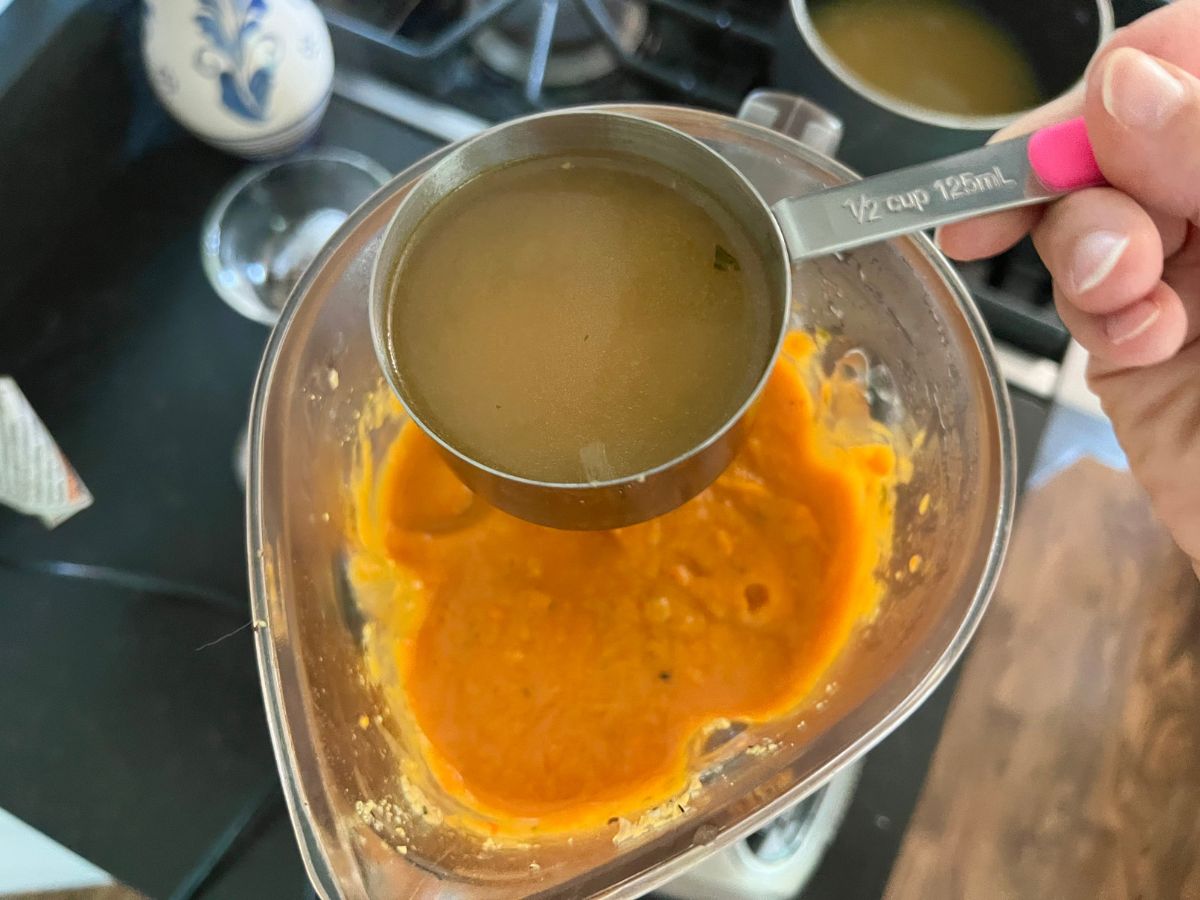 A ½ cup of cooking liquid from the vegetables are added to the blended sweet potato and red pepper mixture.