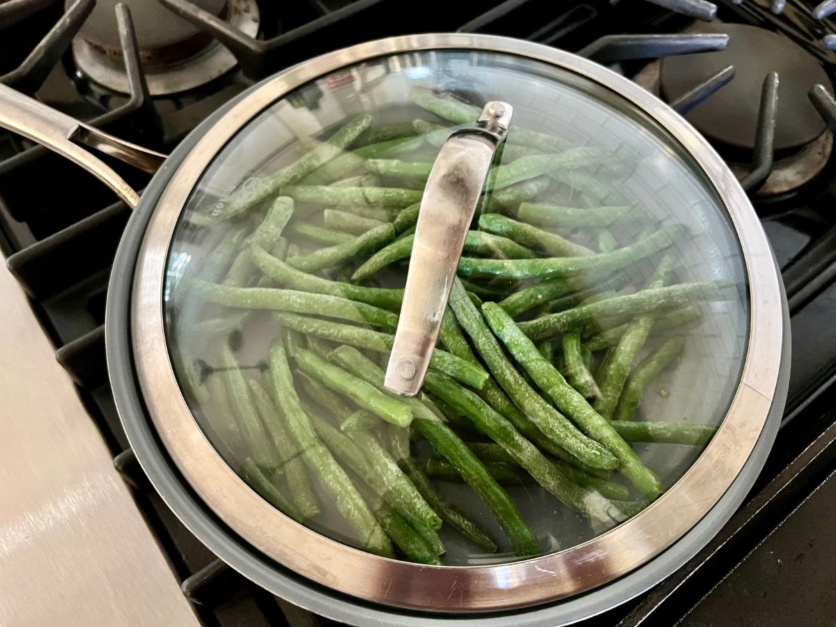 Cover added to the skillet to thaw beans as you begin to cook them.