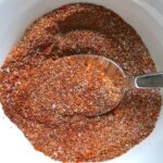 Taco Seasoning for Chicken Recipe -seasonings mixed in bowl (clockwise) smoked paprika, cumin, chili powder, garlic powder, and salt.