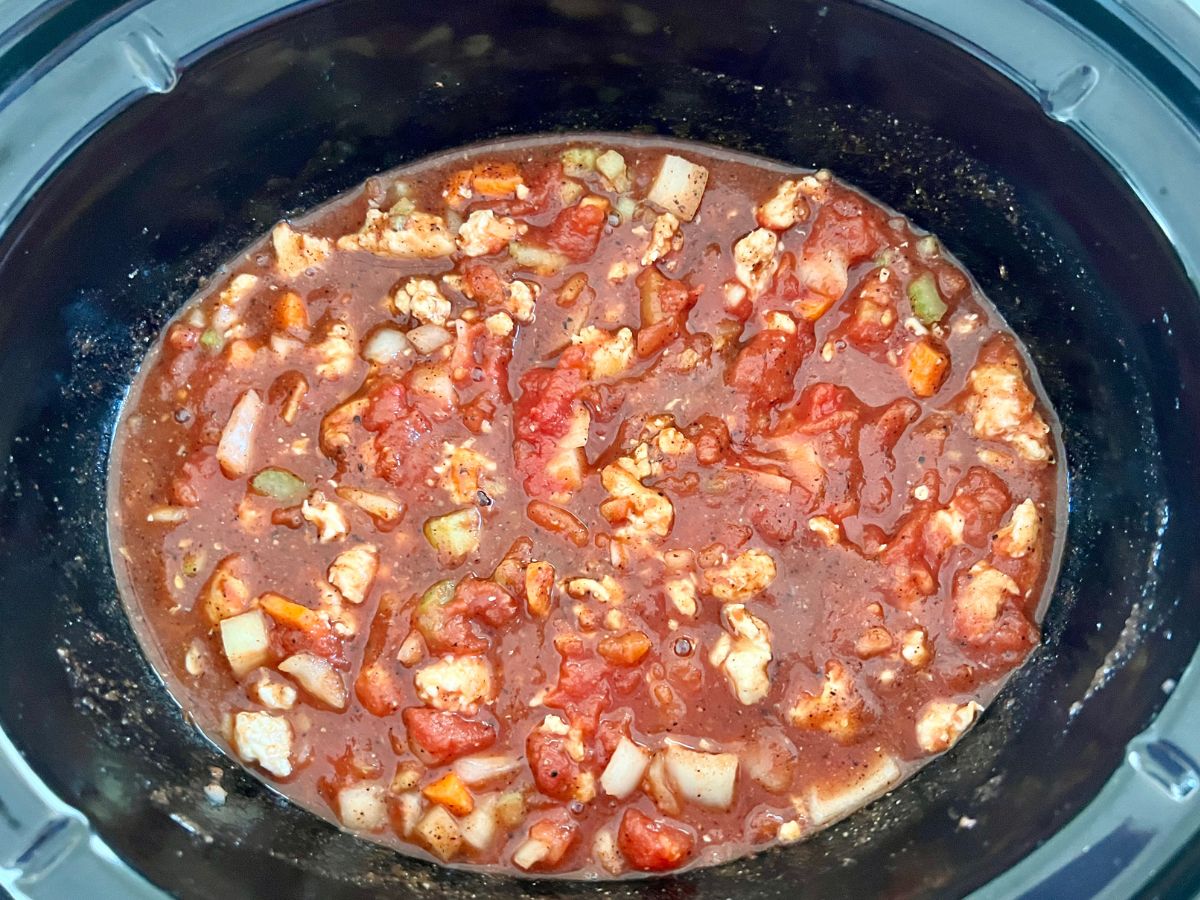 Ground chicken chili cooking in a slow cooker.