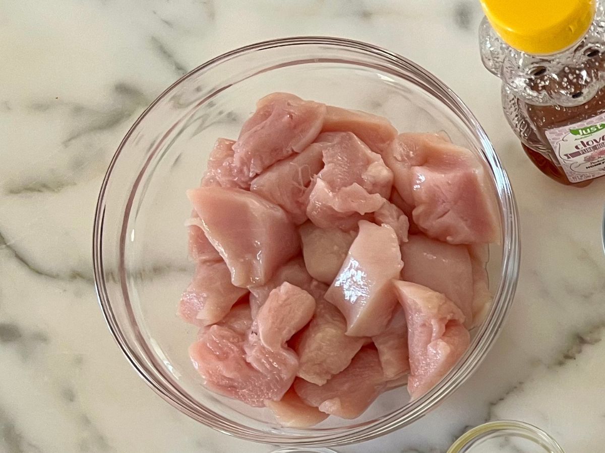 1 inch pieces of chicken breast added a glass mixing bowl.