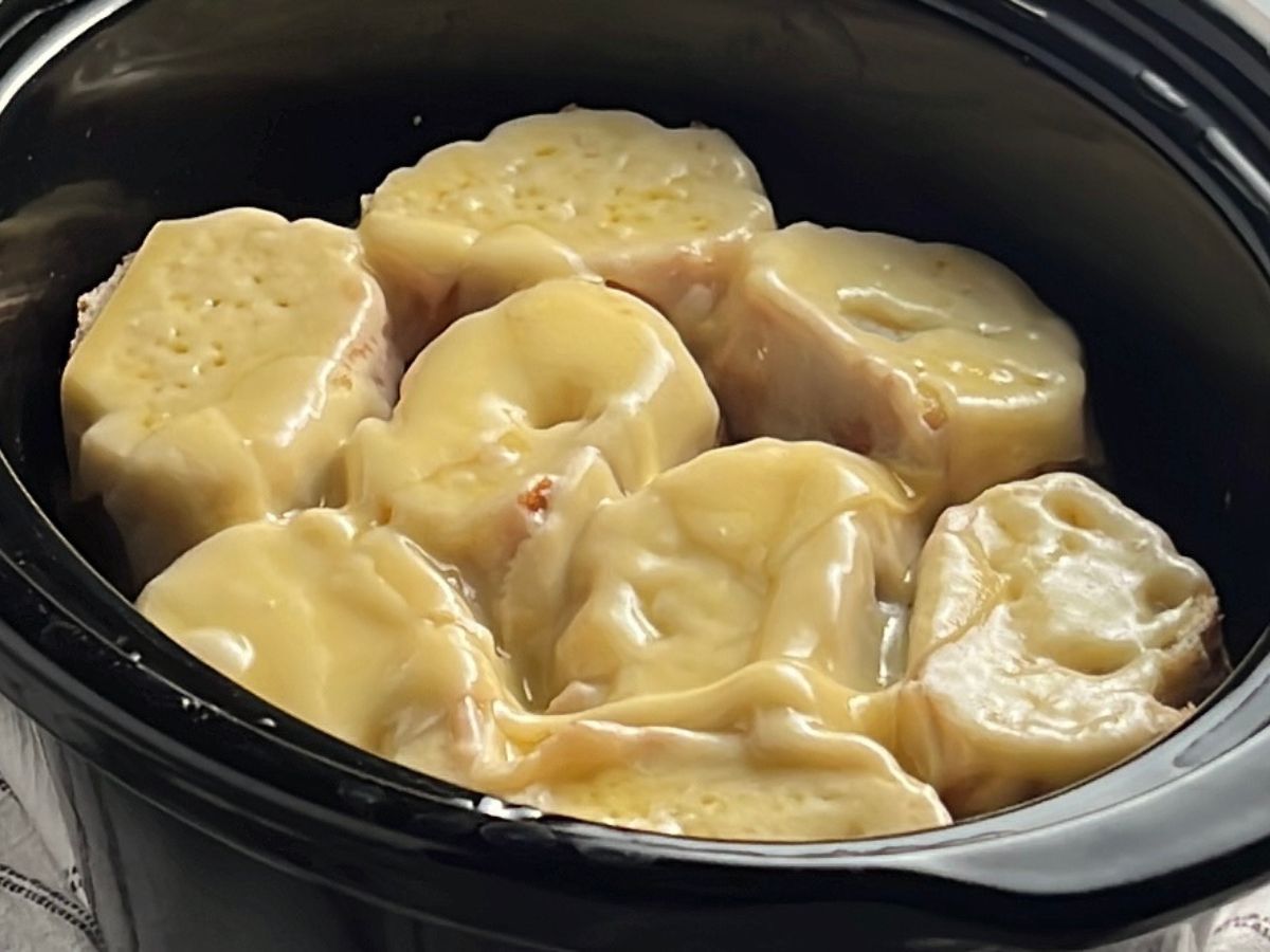 Cheese melted over the slices of baguette that sit on the Chicken French Onion Soup.