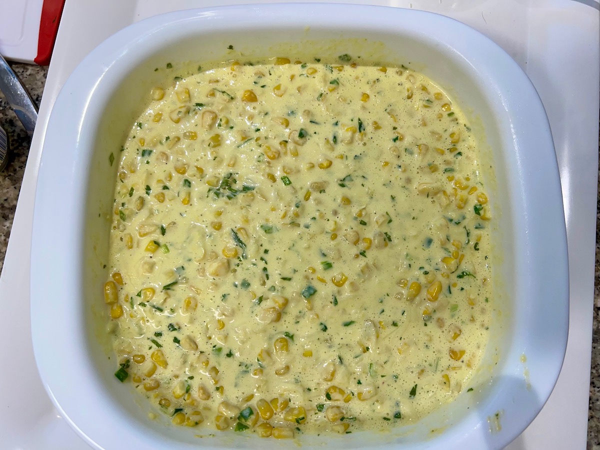 All ingredients added to casserole dish before cooking for the Mexican Street Corn Casserole recipe.